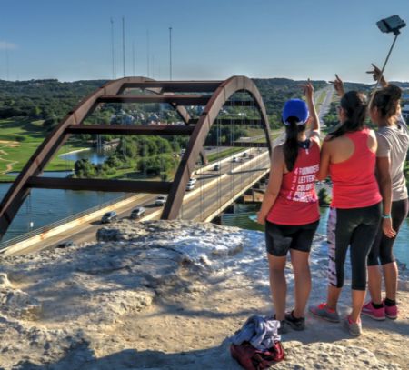 Friends Posing for a Group Selfie at the Pennybacker Bridge Overlook