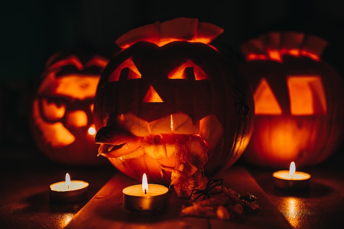 carved pumpkins in the dark