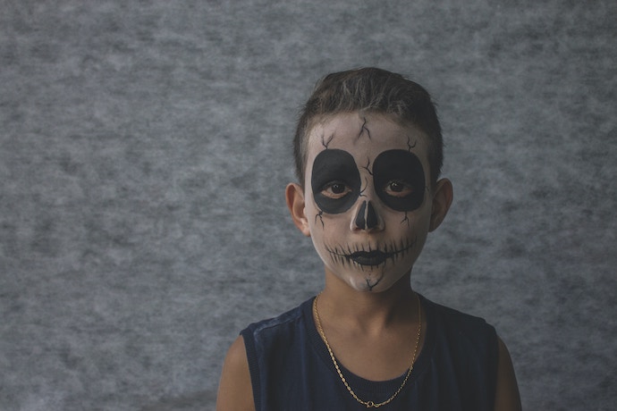 spooky face painting on boy